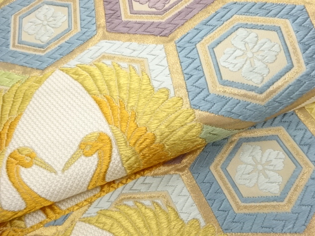  向かい鶴に亀甲・花菱模様織出し袋帯